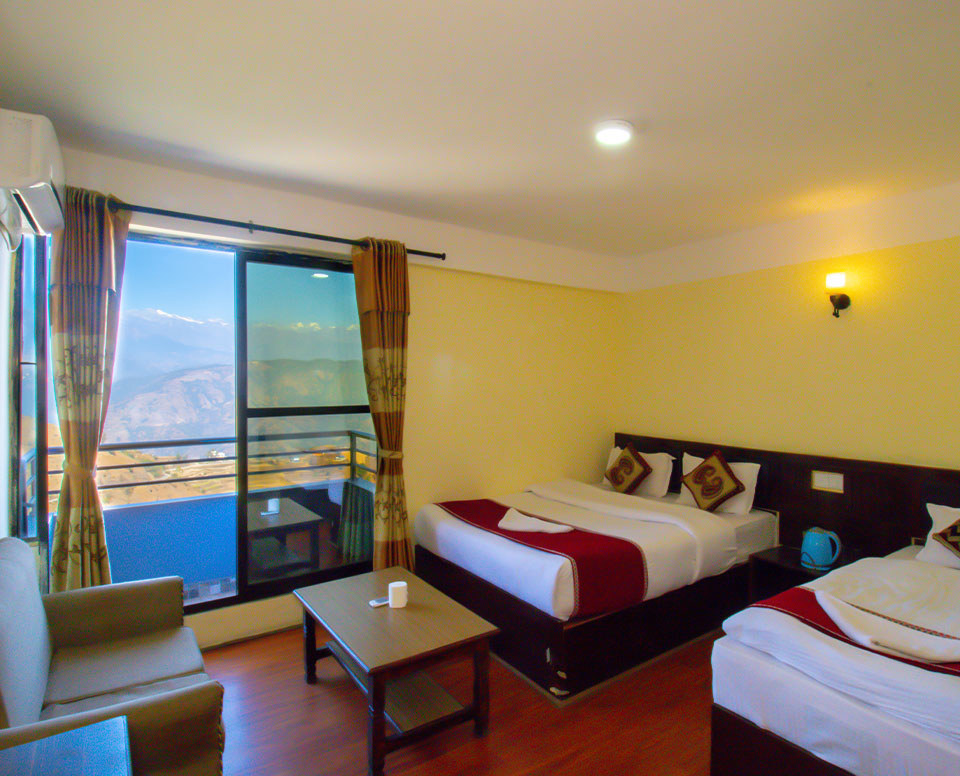 Shiva Parvat AC Room accommodates 3 people with it's 1 King Size Bed and 1 Single Bed.